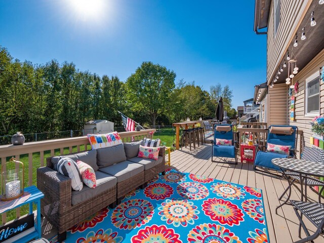 deck featuring outdoor lounge area