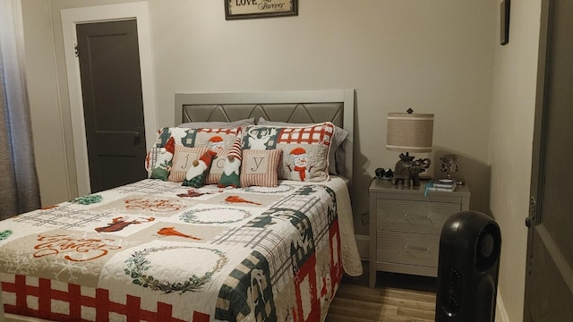 bedroom featuring hardwood / wood-style flooring