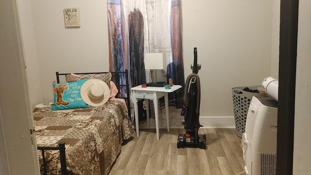 bedroom with light wood-type flooring