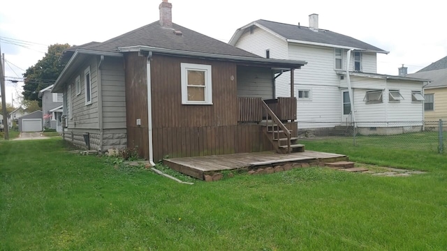 back of house featuring a yard