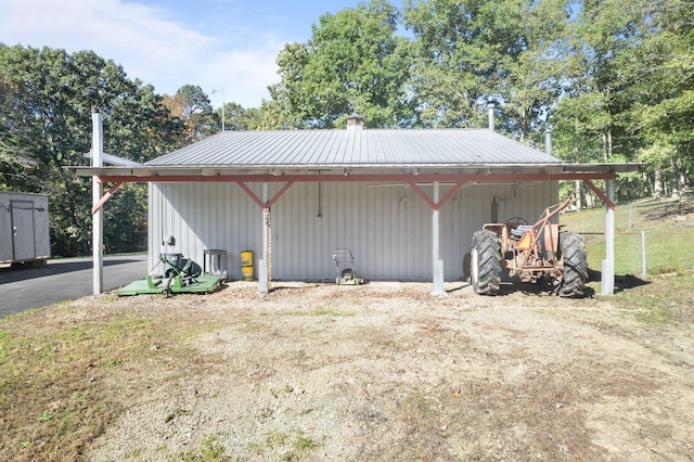 view of side of property featuring an outdoor structure