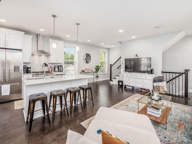 living room featuring dark hardwood / wood-style floors and sink