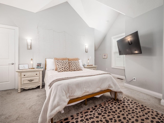 bedroom featuring carpet floors and lofted ceiling