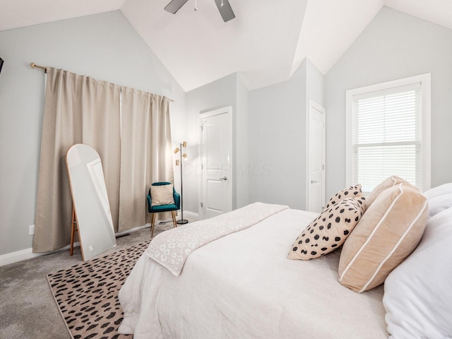 carpeted bedroom with ceiling fan and vaulted ceiling