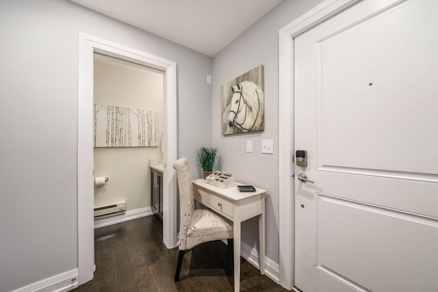 1002 Ewing Aly, Columbus, OH 43201 - doorway to outside with a baseboard heating unit, dark wood-style flooring, and baseboards