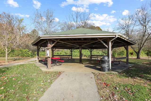 surrounding community with a gazebo and a lawn