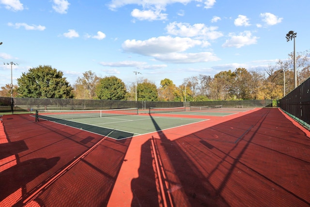 view of tennis court featuring basketball court