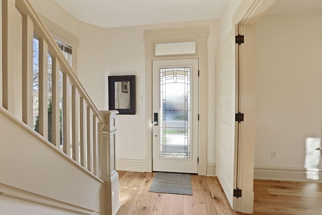 foyer with light hardwood / wood-style flooring