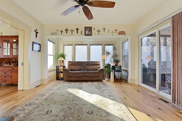 sunroom / solarium with ceiling fan