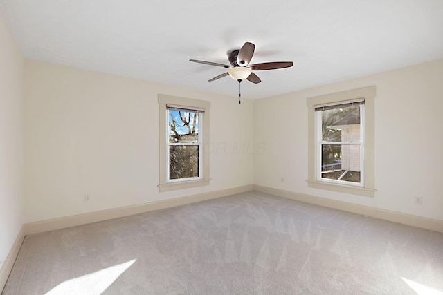 carpeted empty room with ceiling fan