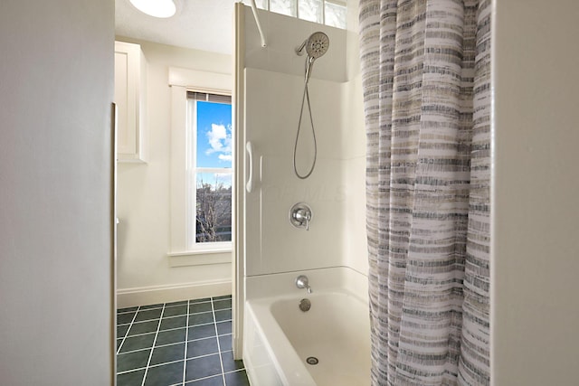 bathroom featuring tile patterned floors and shower / bath combo with shower curtain