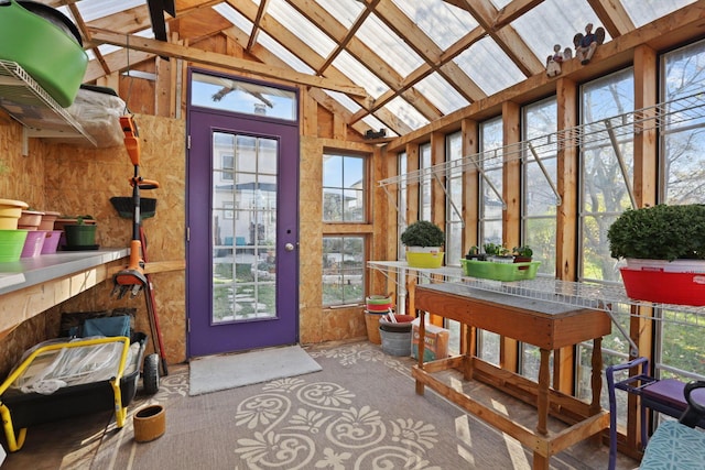 sunroom / solarium with vaulted ceiling with beams