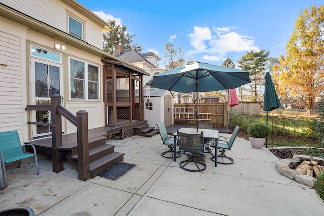 view of patio featuring a storage shed