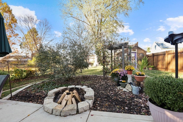 view of yard with an outdoor fire pit