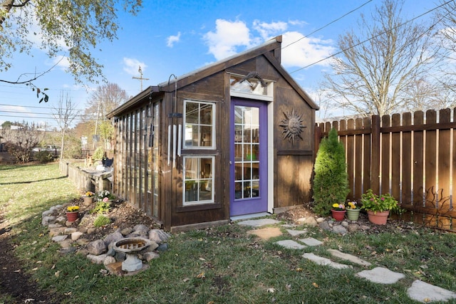 view of outbuilding with a lawn