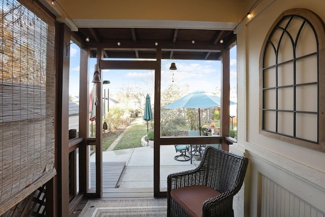 doorway to outside featuring hardwood / wood-style flooring and a wealth of natural light