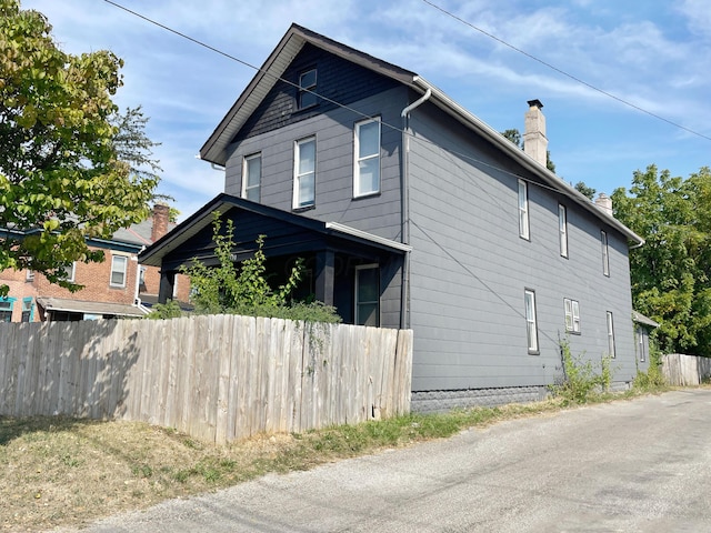 1390 E Livingston Ave, Columbus, OH 43205 - view of side of home featuring a chimney