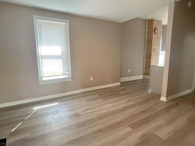 spare room featuring light wood-type flooring