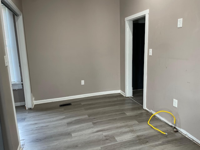 empty room featuring hardwood / wood-style flooring