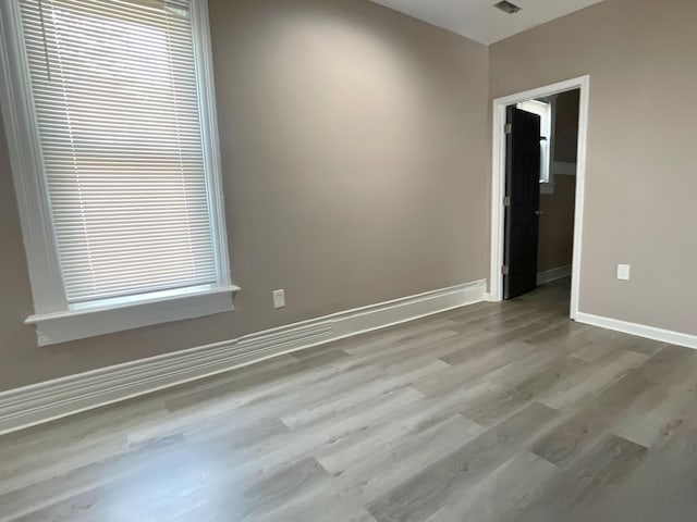 spare room featuring light hardwood / wood-style flooring