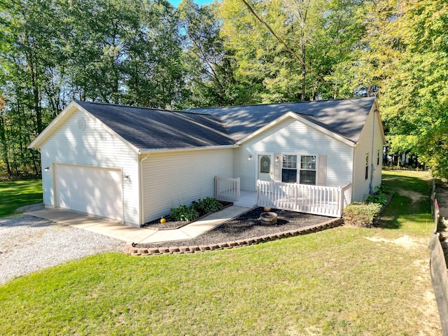 single story home featuring a garage and a front lawn