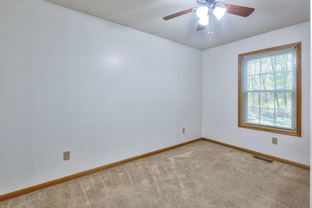 carpeted empty room with ceiling fan