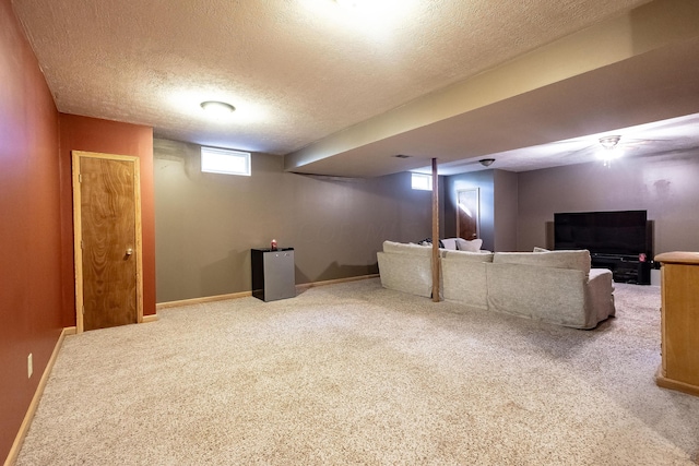 interior space featuring carpet and a textured ceiling