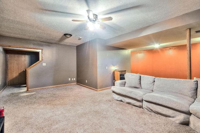 living room with carpet flooring, a textured ceiling, and ceiling fan