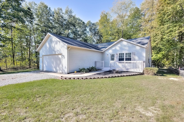 single story home with a garage and a front lawn