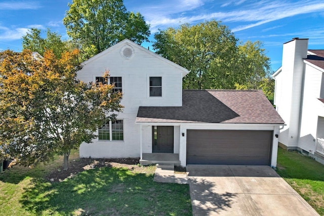 view of front of home featuring a garage and a front lawn