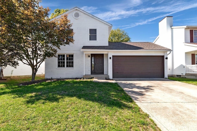 view of front of home featuring a front yard and a garage