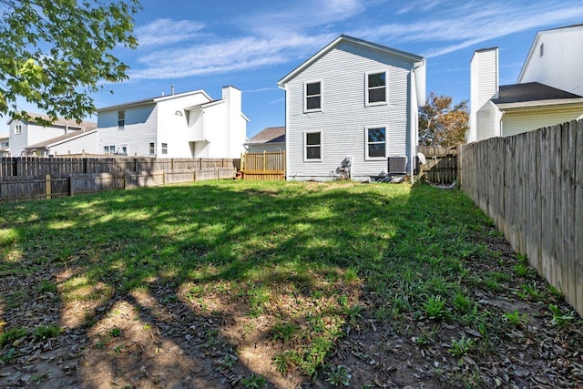 back of house with a lawn