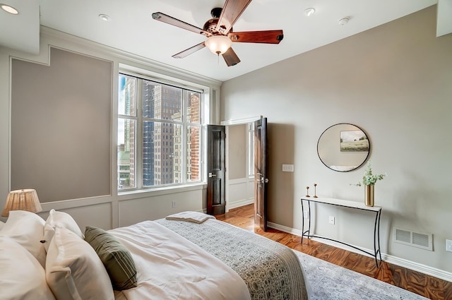 bedroom featuring ceiling fan and light wood-type flooring