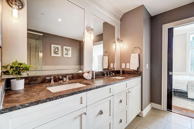 bathroom with tile patterned floors and vanity