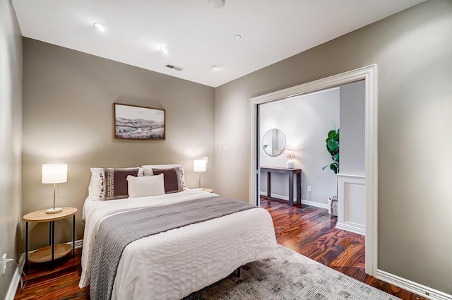 bedroom featuring dark hardwood / wood-style flooring