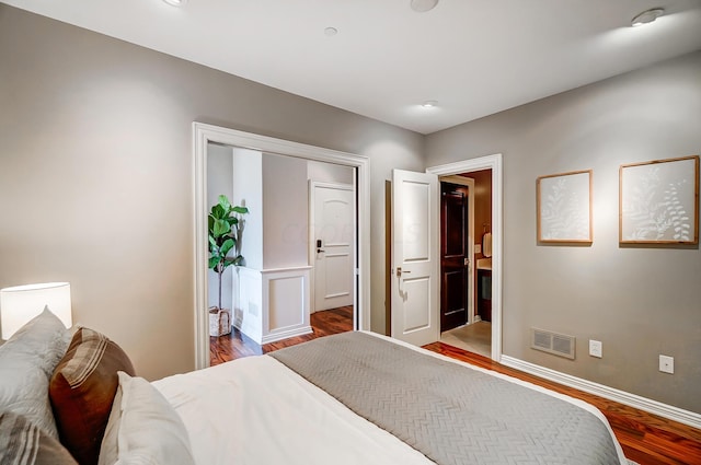 bedroom featuring hardwood / wood-style flooring and a closet