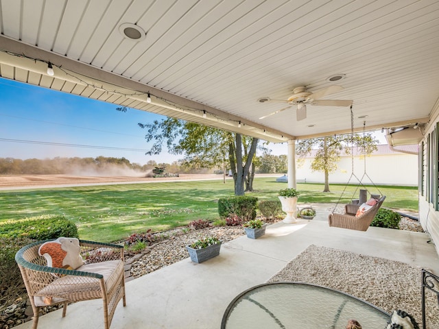 view of patio featuring ceiling fan