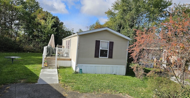 view of side of property with a yard