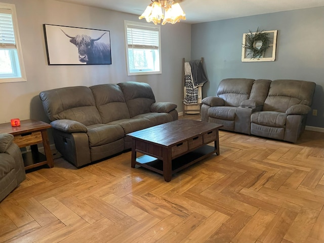 living room featuring a healthy amount of sunlight and light parquet flooring