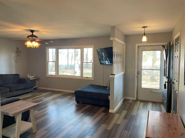 interior space featuring ceiling fan, dark hardwood / wood-style flooring, and a wealth of natural light