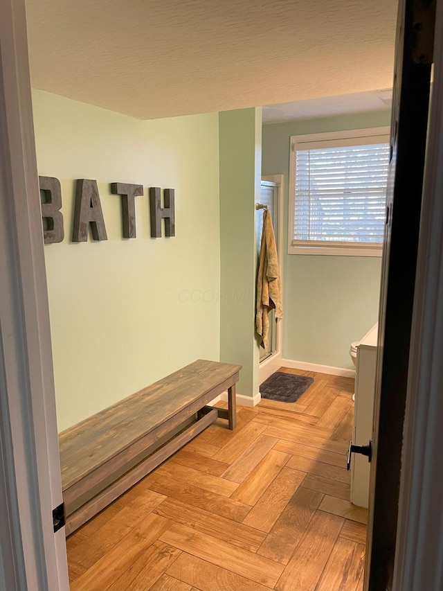 hallway with light parquet flooring