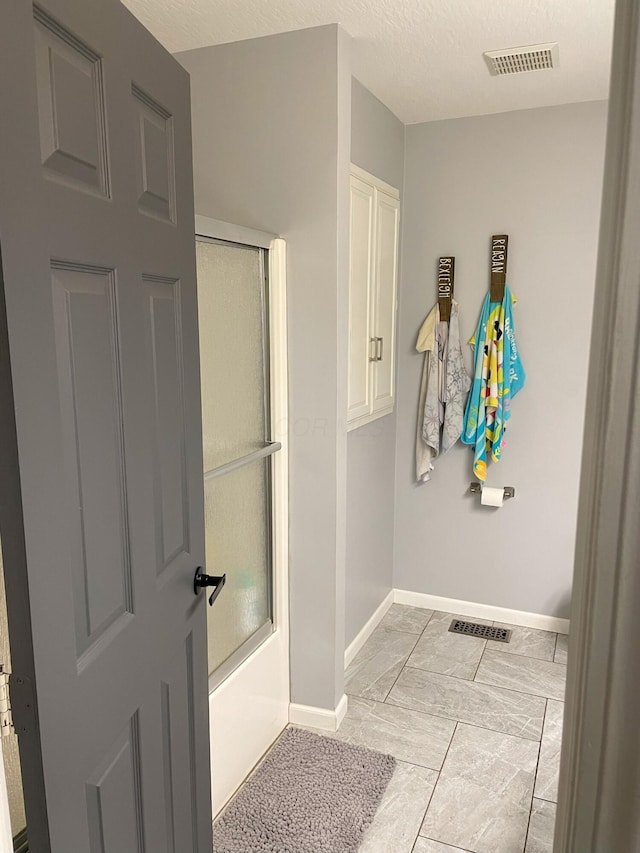 bathroom with a textured ceiling