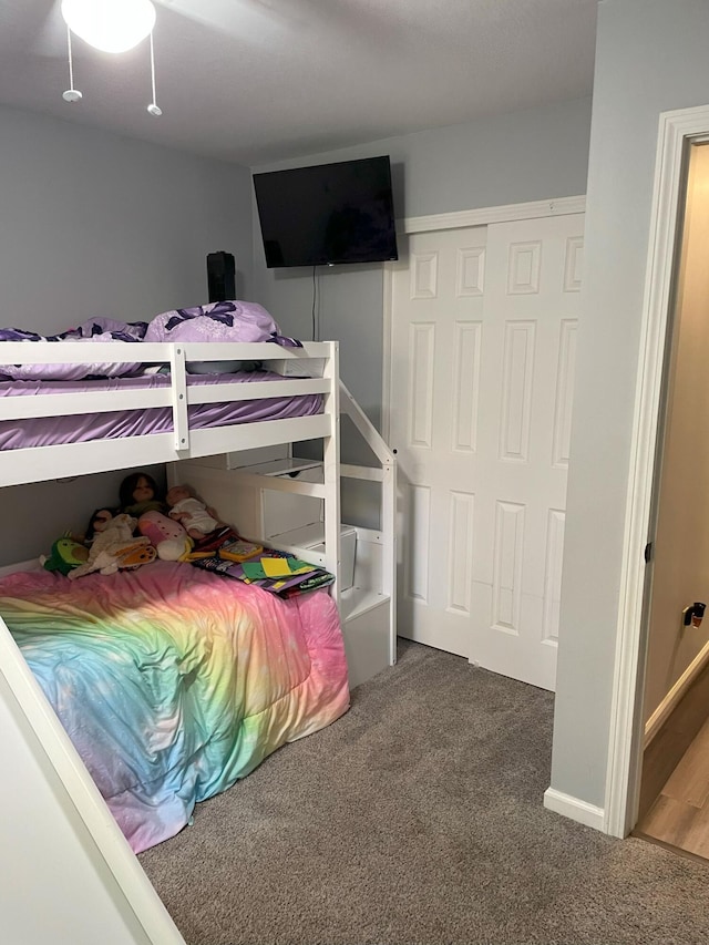 bedroom featuring carpet floors and a closet