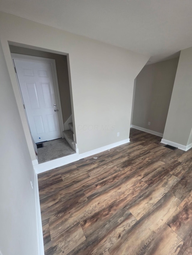 1214 W Mulberry St, Lancaster, OH 43130 - spare room with dark wood-type flooring and stairs