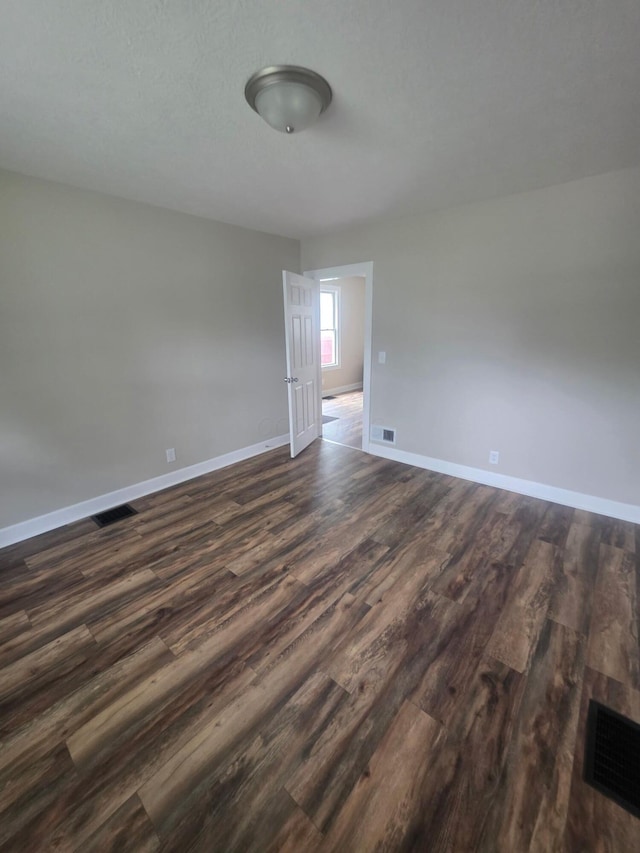1214 W Mulberry St, Lancaster, OH 43130 - spare room with dark wood-type flooring and baseboards