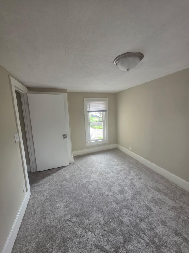 1214 W Mulberry St, Lancaster, OH 43130 - spare room featuring carpet floors and a textured ceiling