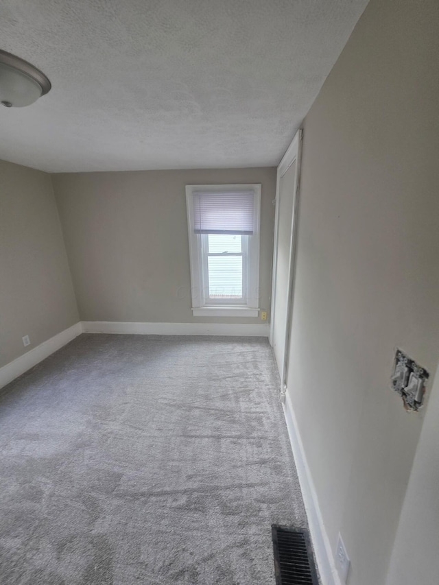 1214 W Mulberry St, Lancaster, OH 43130 - spare room with a textured ceiling and carpet floors