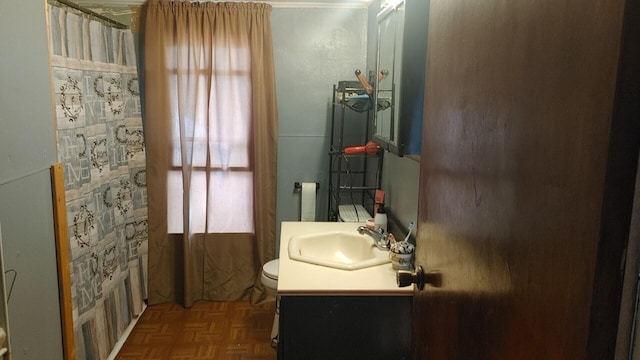 full bathroom with shower / bath combo, vanity, toilet, and parquet floors