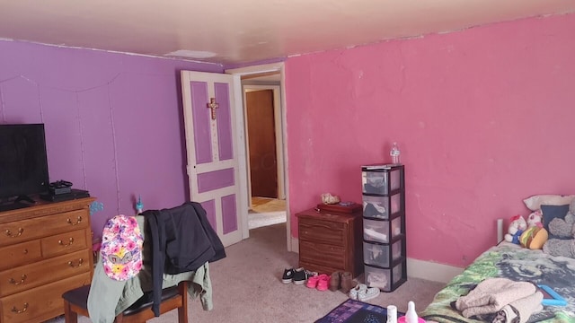 bedroom featuring light colored carpet