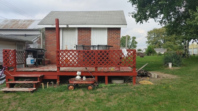 back of property featuring a yard and a wooden deck